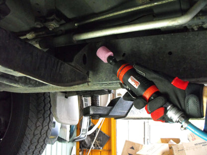 a close up of a wrench on the back of a vehicle